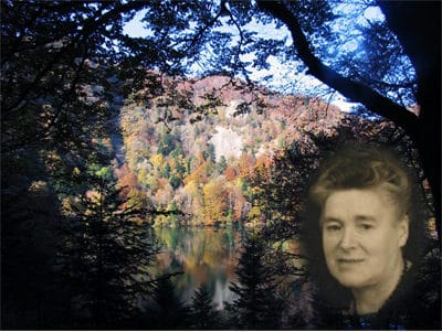 Emma was one of the couriers who passed on forbidden biblical literature at Lac des Perches. The field service meeting was above the rocks that can be seen in the picture