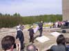 Deputy director of the memorial, Rikola-Gunnar Lüttgenau and former prisoner Max Liebster unveil the memorial stone for the prisoner group Jehovah's Witnesses.